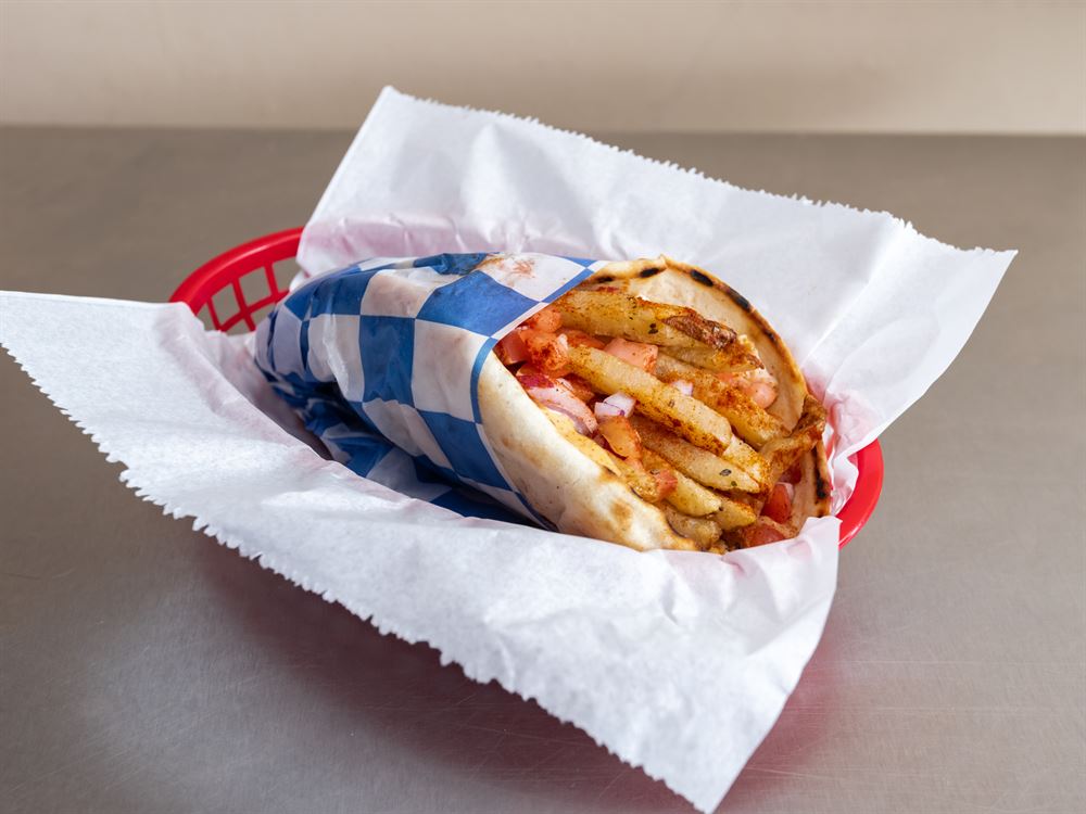 Chicken gyro with fries wrapped in pita