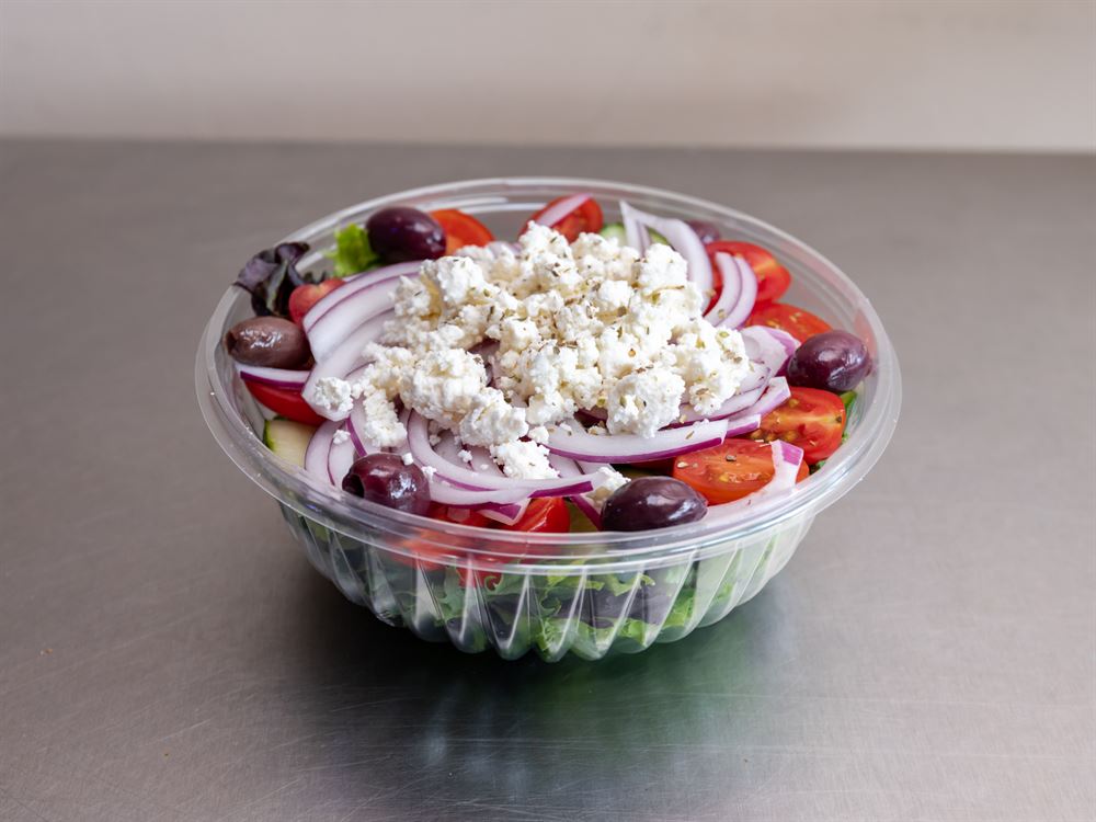 Large Greek salad with feta, olives and red onion